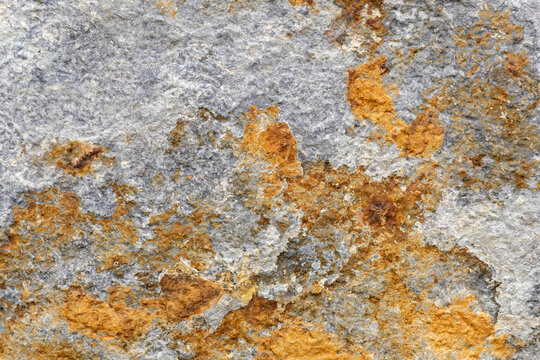 Stone texture. Yellow, gray and maroon tones.