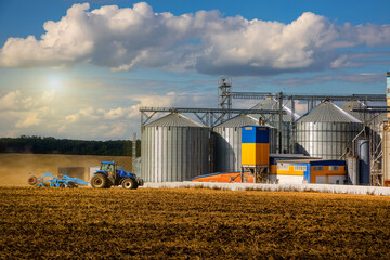Agricultural Silos. Storage and drying of grains, wheat, corn, soy, sunflower against the blue sky...