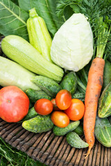 There is a wooden basket with homemade vegetables in the garden. Selective focus. The concept of harvesting from the garden, close-up. Agriculture.