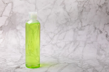 Face care for the face, tonic or lotion, micellar water on a marble background.Beauty...