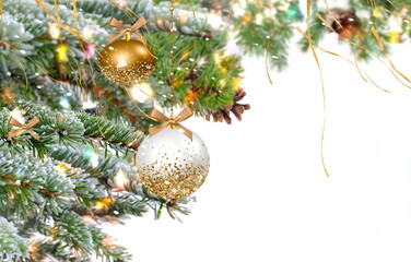 Christmas ball and green pine tree branch with cone on winterwhite  bokeh bakcground snow flakes copy space template banner