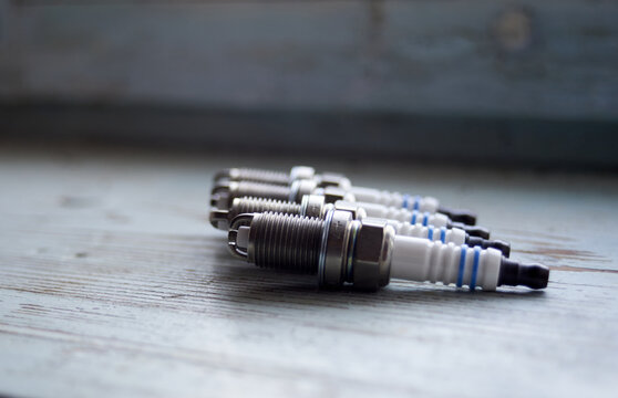 Photo of four new spark plugs