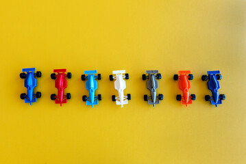toy cars on yellow background, happy children's day.