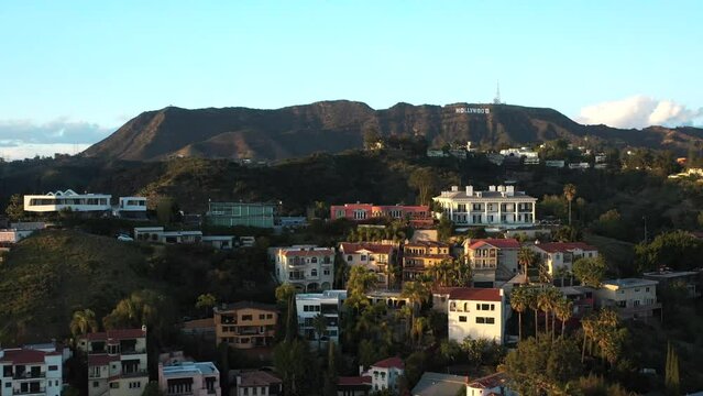 2022 - Excellent aerial view of housing in the Hollyood hills, with the Hollywood sign in the background.