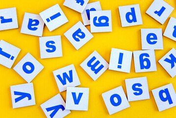 Letters of the alphabet on a yellow background, happy children's day.