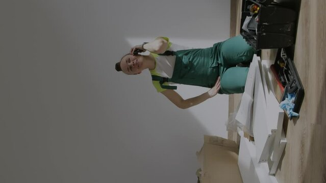 Young female is assembling a piece of furniture