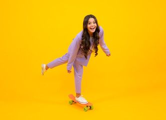 Fototapeta na wymiar Teen hipster girl skater with skateboard on isolated background. Summer kids trend, urban teenage style.