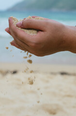 Fototapeta na wymiar sand that runs through the open hands