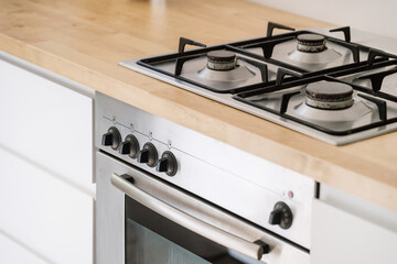 gas stove and electric oven at modern kitchen