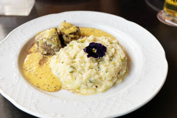 Filet mignon with mustard sauce served with a delicious Italian risotto.