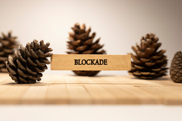 Blockade written on wooden surface. Law and politics.