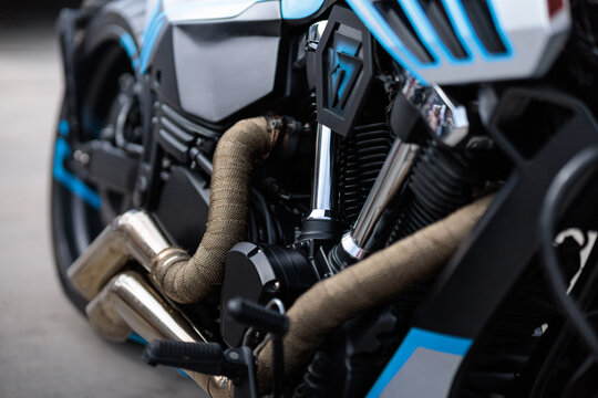 Cropped image of a new motorcycle in the store. Motorcycles and accessories in a modern motorcycle shop. Biker stuff