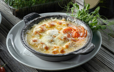 Gourmet Scallop Casserole Baked with Cream and Cheese in a Mediterranean Style