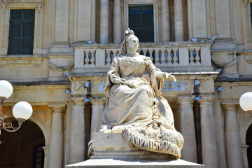 Statue of Queen Victoria in front of National Library, Bibliotheca, Republic Square, in Valletta,  capital city of Malta, 