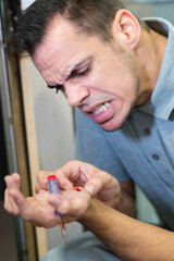 man cut his hand at work