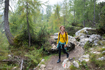 Mid Adult Woman hiking alone in Mountains