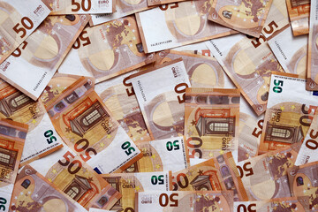 background of banknotes 50 euros beautifully laid out. Euro money. European Union banking, financial savings. concept of economy. banks, money, wealth, finance and business success.