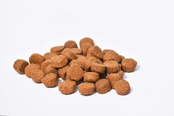Granules of dry food for dogs and cats on a white background top view