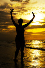 Woman with swimsuit and silhouette in morning