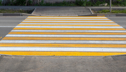 Road marking. Crosswalk, yellow and white lines. Background. Crosswalk. Pedestrian Crossing Sign