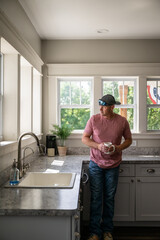 Marine veteran at home with family on a early morning in the kitchen.