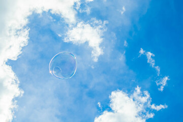 soap bubble on blue sky background, concept