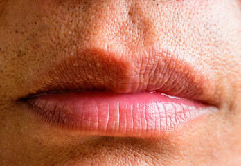 Tanned Asian men's lips close-up