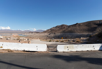 closed defunct Echo Bay Marina Lake Mead blocked launch ramp receding water more than a mile away August 2022