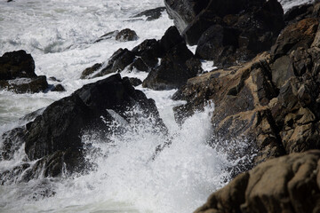 Ocean waves crashing against a rocky shore