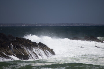 Ocean waves crashing against a rocky shore