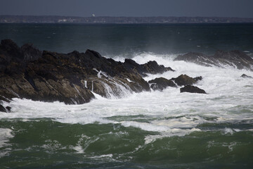 Ocean waves crashing on a rocky shore