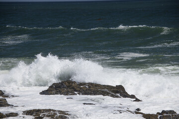 Ocean waves crashing on a rocky shore
