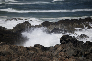 Ocean waves crashing against a rocky shore