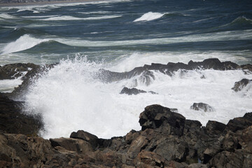 Ocean waves crashing against a rocky shore
