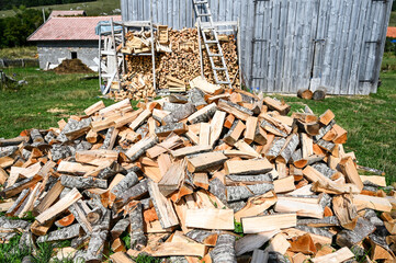 Chopped firewood. Logs of firewood for heating. Stock for winter.