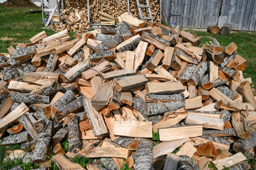 Chopped firewood. Logs of firewood for heating. Stock for winter.
