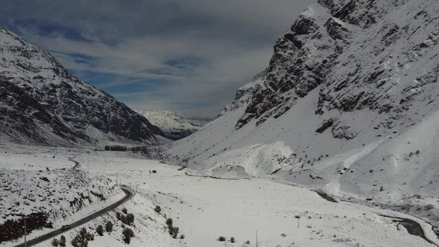 Trekking in winter season. Snowed mountains in La Egorda Valley, Caj n del Maipo, central Andes mountain range, Chile