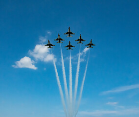 USAF Thunderbird Demonstration team fly in formation during an air show. - Powered by Adobe