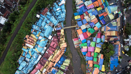 Aerial view of the old slum village Jodipan with colorful houses in Malang city.