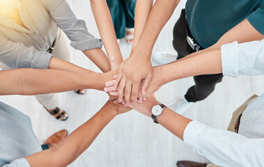 Support, trust and collaboration of business people pile hands together in agreement of partnership in an office. Teamwork, team building and celebrating company growth and diversity