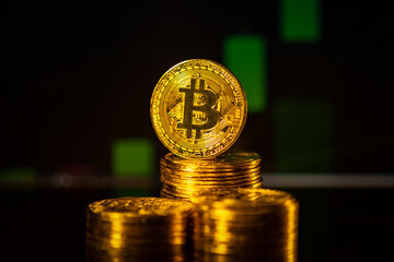 Cryptocurrency concept. Bitcoin with dark stock chart background