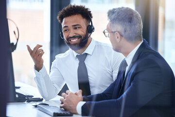 Call center agent or telemarketing employee consulting a business man and talking about company growth. Happy male customer service employee in training with an HR manager at the office