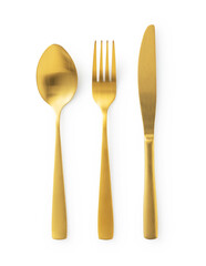 Gold knives, forks and spoons placed on a white background. Beautiful gold cutlery.