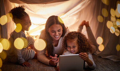 Mother, children and tablet with happy family watching online tv, learning with education games and...