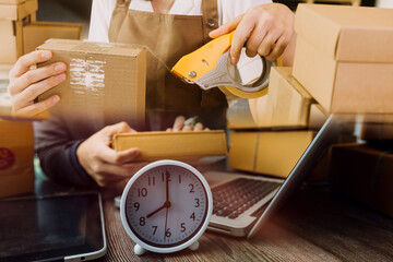 Portrait of Starting small businesses SME owners, two Asian woman check online orders Selling products working with boxs freelance work at home office, sme business online small medium enterprise