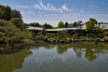 The stone bridge and the garden pond of Shinen inside the Heian-Jingu shrine.  Kyoto Japan

