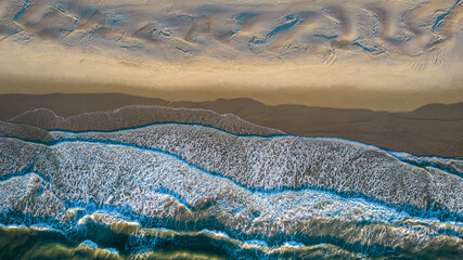 Aerial view of coastline and sand dunes of Ocracoke Island at sunrise, North Carolina, USA. 