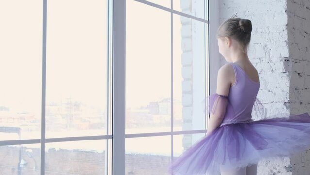 Young girls from ballet dancing ballet in white studio. Pretty graceful ballerinas doing elements of classical ballet - arts concept 4k footage