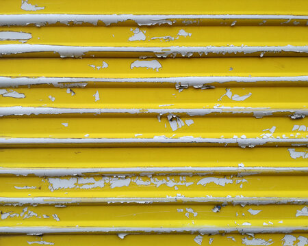 Yellow Metal Wall With Peeling Paint.