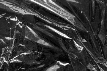 transparent plastic bag film wrap overlay texture on black background